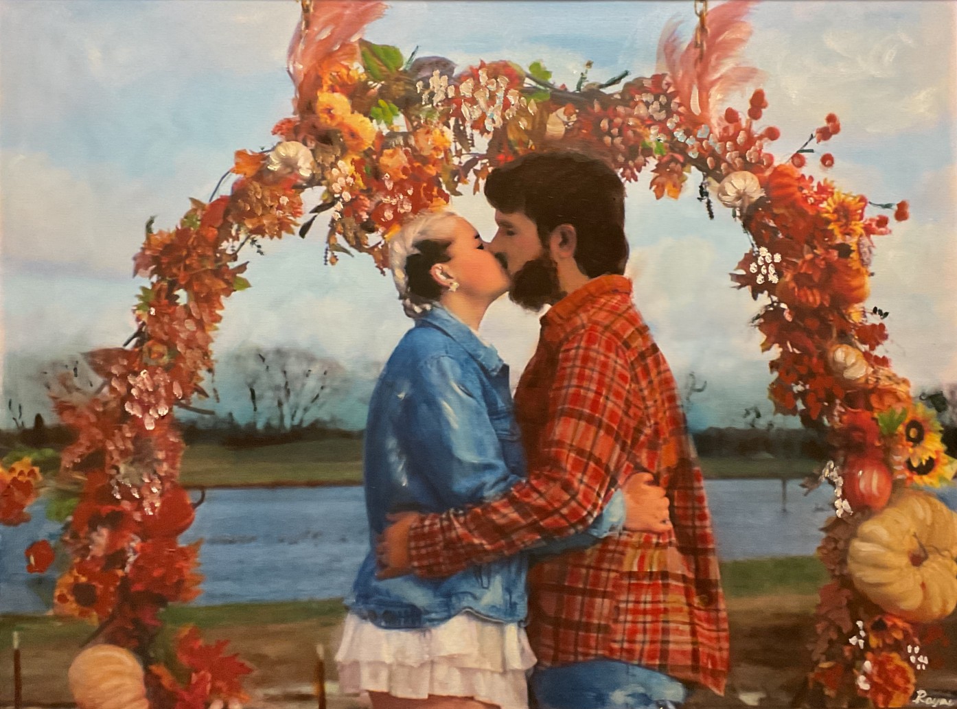 Commissioned wedding portrait of a couple beneath an autumn floral arch