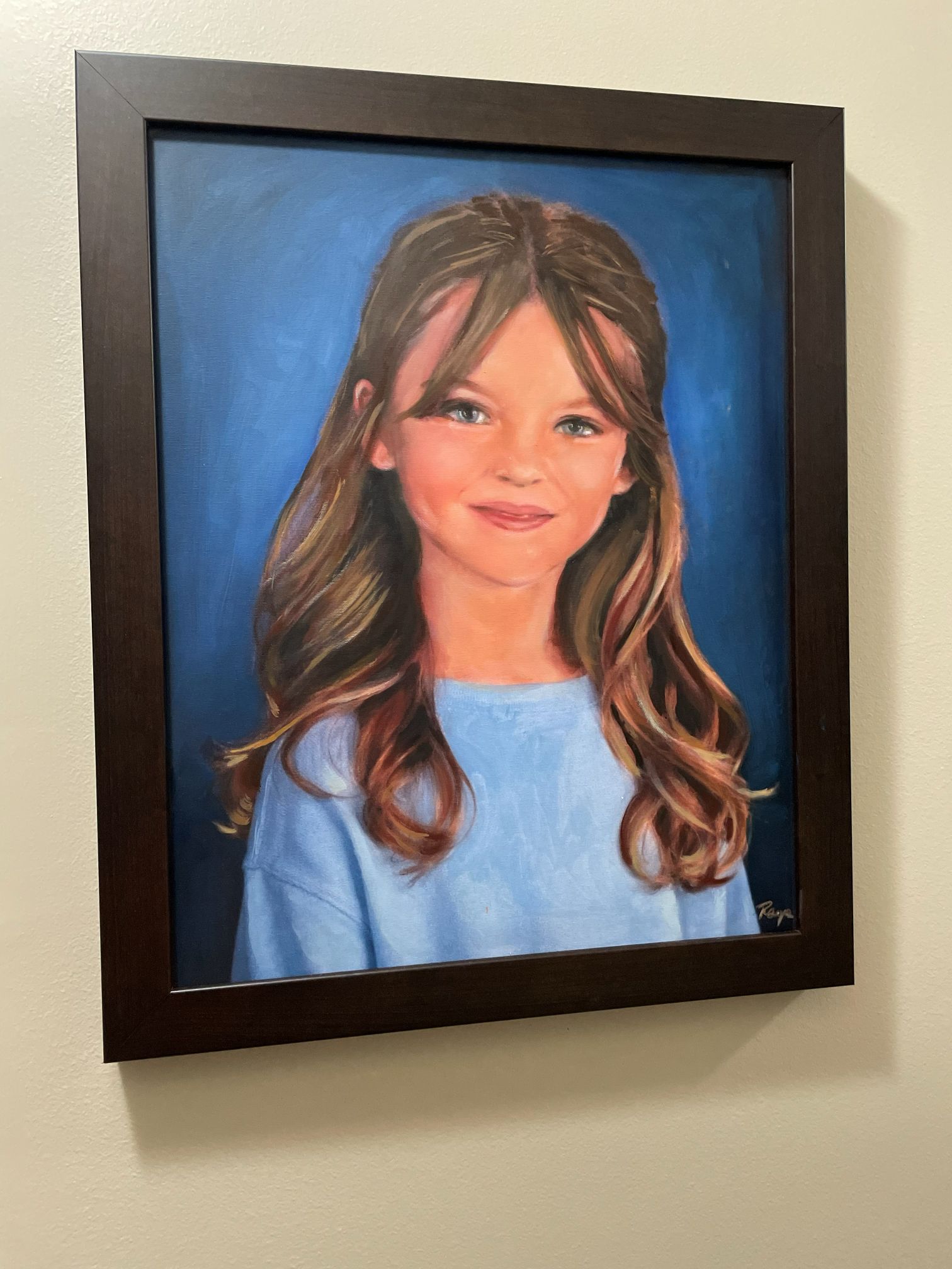 Commissioned portrait of a young girl against a blue background